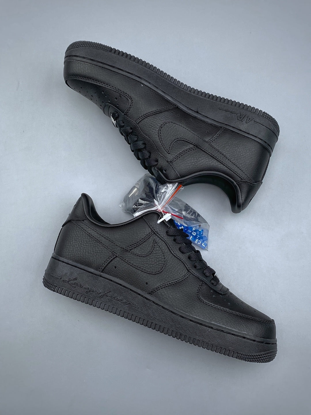 Black low-top sneakers, pair view