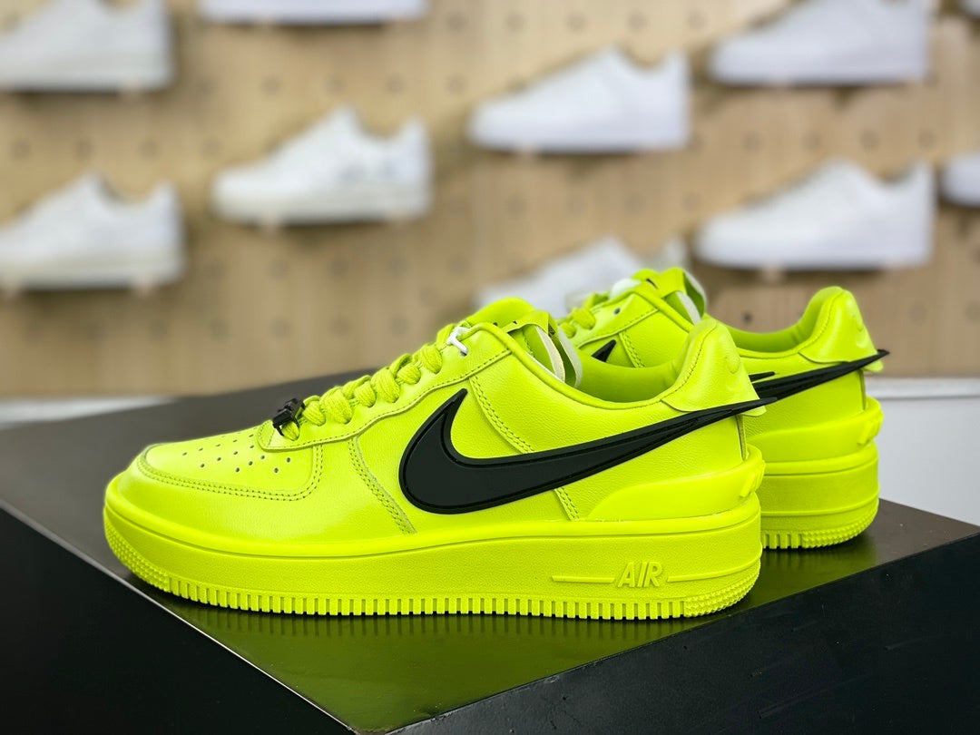Neon yellow and black low-top sneakers with extended side detail, view 2