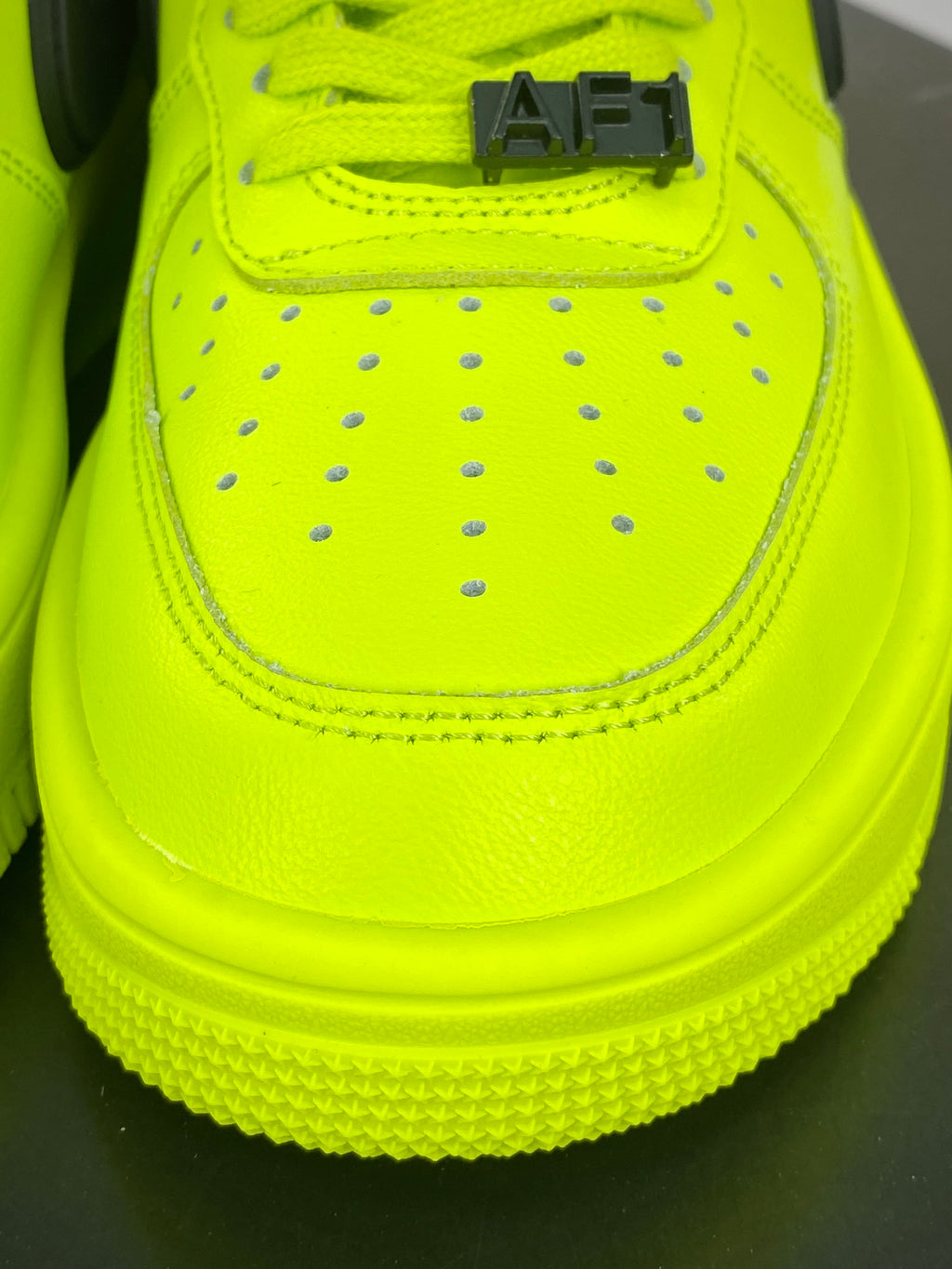 Neon yellow and black low-top sneakers with extended side detail, view 4