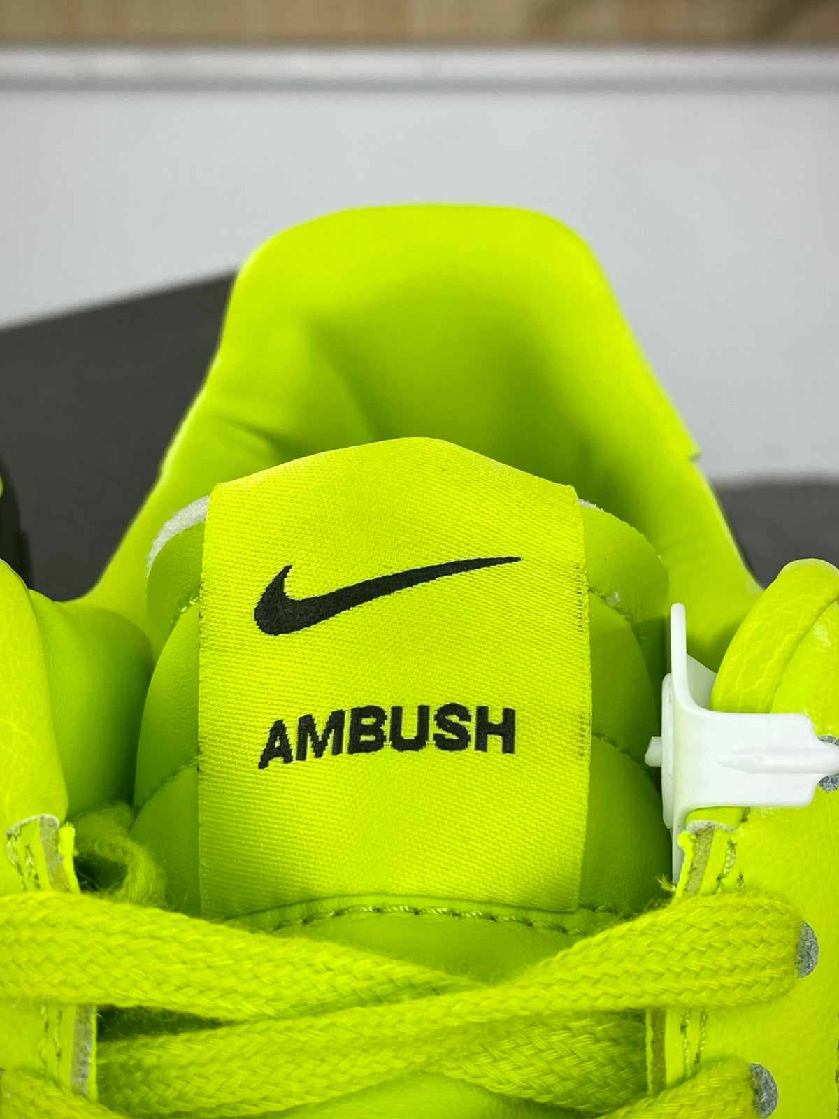 Neon yellow and black low-top sneakers with extended side detail, view 7