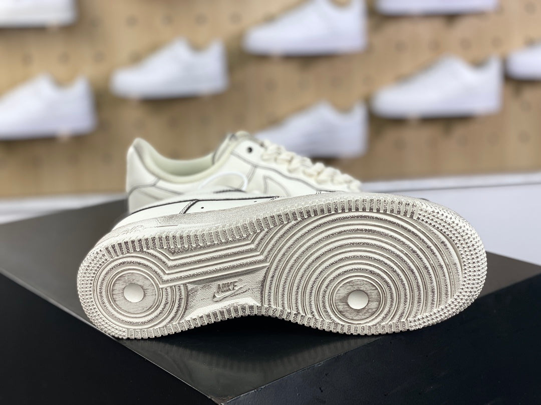 Cream low-top sneakers with rope laces and dark contrast stitching