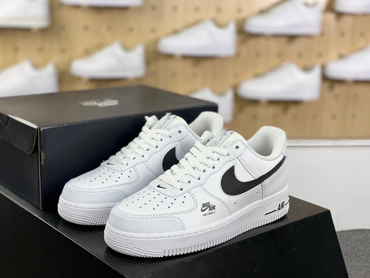 White and black low-top sneaker pair